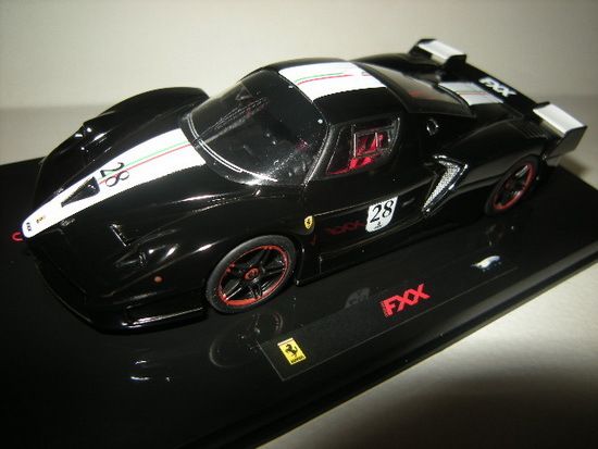 MATTEL - 1:43 FERRARI FXX BLACK DAYTONA WITH ITALIAN FLAG